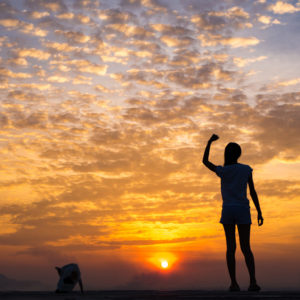 Lady stood under the sunset